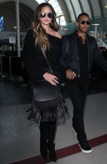 CHRISSY TEIGEN at Los Angeles International Airport 12/03/2016