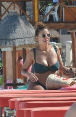 DEVIN BRUGMAN in Bikini on the Beach in Cancun 12/15/2016