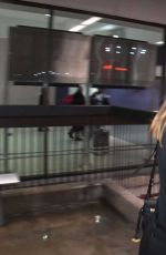 ELLE FANNING at LAX AIrport in Los Angeles 12/15/2016
