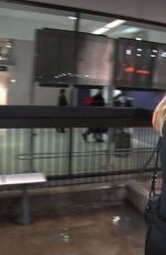 ELLE FANNING at LAX AIrport in Los Angeles 12/15/2016