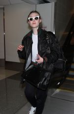 ELLE FANNING at Los Angeles International Airport 12/08/2016