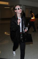 ELLE FANNING at Los Angeles International Airport 12/08/2016