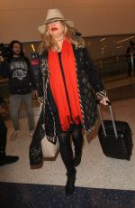 JENNIFER COOLIDGE at LAX Airport in Los Angeles 12/20/2016