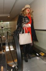 JENNIFER COOLIDGE at LAX Airport in Los Angeles 12/20/2016