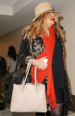 JENNIFER COOLIDGE at LAX Airport in Los Angeles 12/20/2016