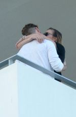 KATIE CASSIDY Kisses Her Boyfriend on the Balcony of Her Hotel in Miami 12/14/2016