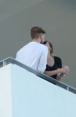 KATIE CASSIDY Kisses Her Boyfriend on the Balcony of Her Hotel in Miami 12/14/2016