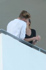 KATIE CASSIDY Kisses Her Boyfriend on the Balcony of Her Hotel in Miami 12/14/2016