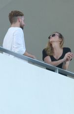KATIE CASSIDY Kisses Her Boyfriend on the Balcony of Her Hotel in Miami 12/14/2016