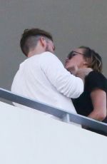 KATIE CASSIDY Kisses Her Boyfriend on the Balcony of Her Hotel in Miami 12/14/2016