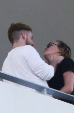 KATIE CASSIDY Kisses Her Boyfriend on the Balcony of Her Hotel in Miami 12/14/2016
