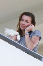 KATIE CASSIDY Kisses Her Boyfriend on the Balcony of Her Hotel in Miami 12/14/2016