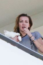 KATIE CASSIDY Kisses Her Boyfriend on the Balcony of Her Hotel in Miami 12/14/2016