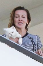 KATIE CASSIDY Kisses Her Boyfriend on the Balcony of Her Hotel in Miami 12/14/2016