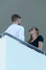 KATIE CASSIDY Kisses Her Boyfriend on the Balcony of Her Hotel in Miami 12/14/2016