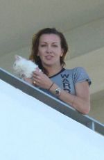 KATIE CASSIDY Kisses Her Boyfriend on the Balcony of Her Hotel in Miami 12/14/2016