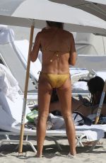 KELLY BENSIMON in Gold Bikini in Miami Beach 12/28/2016
