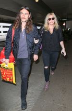 KESHA and Her Boyfriend Brad Ashenfelter at LAX Airport 12/21/2016