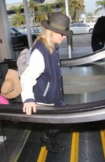 KIM BASINGER at LAX Airport in Los Angeles 12/05/2016