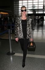MELANIE GRIFFITH at LAX Airport in Los Angeles 12/09/2016