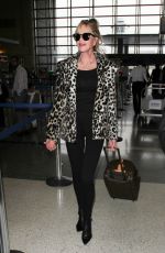 MELANIE GRIFFITH at LAX Airport in Los Angeles 12/09/2016