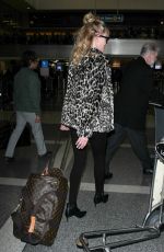 MELANIE GRIFFITH at LAX Airport in Los Angeles 12/09/2016