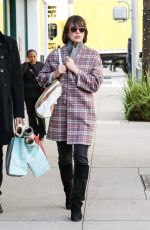 MILLA JOVOVICH Out Shopping in Beverly Hills 12/22/2016