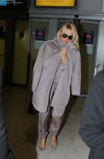 PAMELA ANDERSON at Charles De Gaulle Airport in Paris 12/17/2016