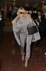 PAMELA ANDERSON at Charles De Gaulle Airport in Paris 12/17/2016