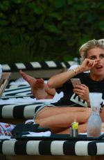 XENIA TCHOUMITCHEVA and CAROLINE DAUR at a Pool in Miami 12/07/2016
