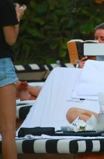 XENIA TCHOUMITCHEVA and CAROLINE DAUR at a Pool in Miami 12/07/2016