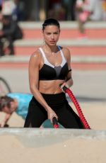 ADRIANA LIMA on the Set of Victoria