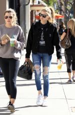 CHARLOTTE MCKINNEY in Ripped Jeans Out in Beverly Hills 01/30/2017