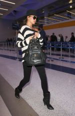 CHRISSY TEIGEN and John Legend at LAX Airport in Los Angeles 01/06/2017