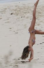 IZABEL GOULARD in Bikini Doing Gymnastic on the Beach in St. Barts 12/31/2016