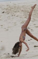 IZABEL GOULARD in Bikini Doing Gymnastic on the Beach in St. Barts 12/31/2016