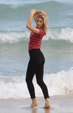 JOY CORRIGAN on the Set of a Photoshot on the Beach in Miami 01/15/2017
