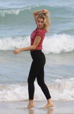 JOY CORRIGAN on the Set of a Photoshot on the Beach in Miami 01/15/2017