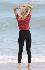 JOY CORRIGAN on the Set of a Photoshot on the Beach in Miami 01/15/2017