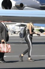 KHLOE KARDASHIAN Boarding a Private Jet in Los Angeles 01/26/2017