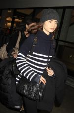 LILY COLLINS at LAX Airport in Los Angeles 01/23/2017