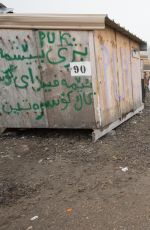 PAMELA ANDERSON at a Refugee Camp in Grande-synthe 01/25/2017