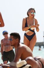 BELLA THORNE and Friends in Bikinis at a Beach in Cancun 02/16/2017