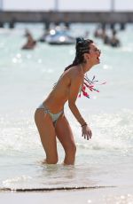 BELLA THORNE and Friends in Bikinis at a Beach in Cancun 02/16/2017