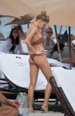CHARLOTTE MCKINNEY in Bikini at a Beach in Miami 02/19/2017