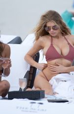 CHARLOTTE MCKINNEY in Bikini at a Beach in Miami 02/19/2017