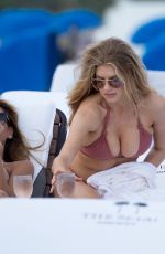 CHARLOTTE MCKINNEY in Bikini at a Beach in Miami 02/19/2017
