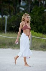CHARLOTTE MCKINNEY in Bikini at a Beach in Miami 02/19/2017
