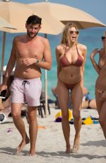 CHARLOTTE MCKINNEY in Bikini at a Beach in Miami 02/19/2017