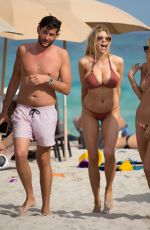 CHARLOTTE MCKINNEY in Bikini at a Beach in Miami 02/19/2017